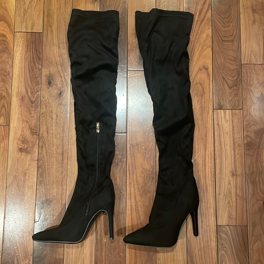 Black knee high heeled boots